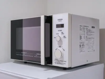 a microwave oven sitting on top of a shelf at m2\u30db\u30c6\u30eb in Tokyo