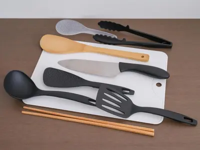 a group of utensils sitting on top of a table at m2\u30db\u30c6\u30eb in Tokyo