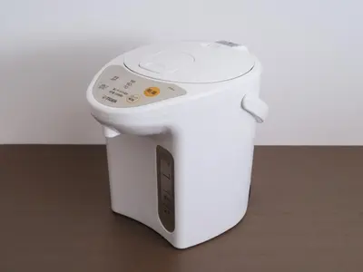 a white toaster sitting on top of a wooden floor at m2\u30db\u30c6\u30eb in Tokyo