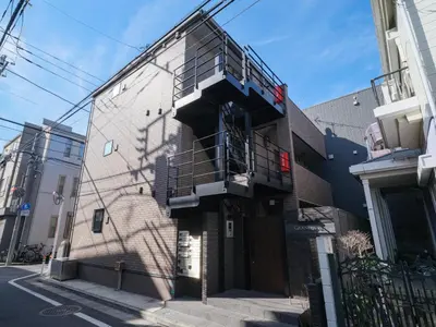 a building with a staircase on the side of it at m2\u30db\u30c6\u30eb in Tokyo