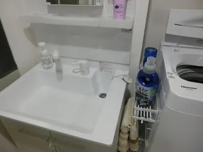a bathroom with a white sink and a toilet at \u6e0b\u8c37\u533a\u4ee3\u3005\u6728302 in Tokyo