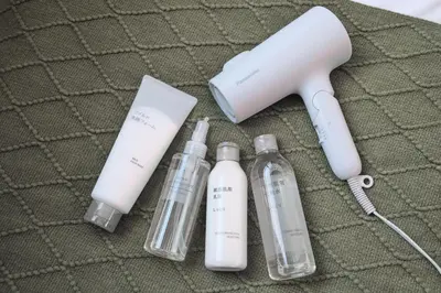 a wii remote and three bottles on a table at Monzen-nakacho 1LDK with projector, 2 double beds,301 in Tokyo