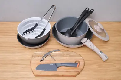 a cutting board with two measuring cups and a spatula at Monzen-nakacho 1LDK with projector, 2 double beds,301 in Tokyo