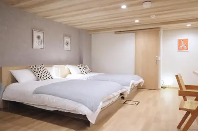 a bedroom with two beds in a room at \u5922\u306e\u820e\u4e0a\u5317\u6ca2 Yumenoya Kamikitazawa in Tokyo