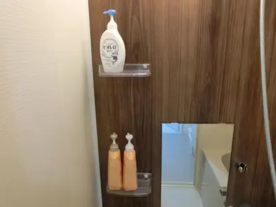 a bathroom with two bottles of soap and a mirror at \u6e0b\u8c37\u533a\u4ee3\u3005\u6728401 in Tokyo