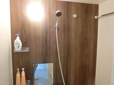 a bathroom with a shower with a light and a mirror at \u6e0b\u8c37\u533a\u4ee3\u3005\u6728401 in Tokyo