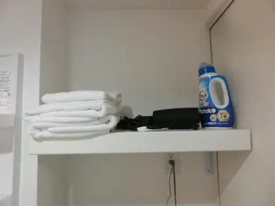 a shelf with towels and a hair dryer on it at \u6e0b\u8c37\u533a\u4ee3\u3005\u6728402 in Tokyo