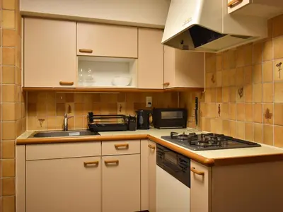 a kitchen with a sink and a stove at \u30b5\u30f3\u30e2\u30fc\u30eb\u30af\u30ec\u30b9\u30c8607 in Tokyo