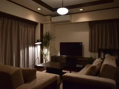 a living room with two couches and a flat screen tv at \u30b5\u30f3\u30e2\u30fc\u30eb\u30af\u30ec\u30b9\u30c8607 in Tokyo