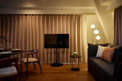 a living room with a couch and a table at 5min to Shibakoen 49square meters Cozy Stay Near Tokyo Tower in Tokyo
