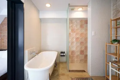 a bathroom with a bath tub and a shower at 5min to Shibakoen 49square meters Cozy Stay Near Tokyo Tower in Tokyo