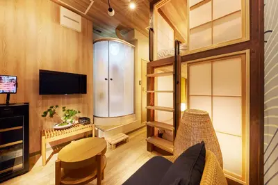 a tiny house with a living room and a tv at \u30de\u30a4\u30b0\u30ec petit \u6e0b\u8c37\u539f\u5bbf in Tokyo