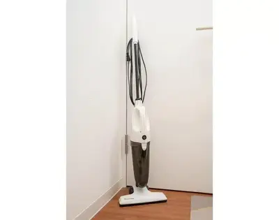 a black and white lamp in a corner next to a door at My Sumida Home 2A in Tokyo