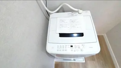 a fax machine is attached to a wall at THE\u6771\u4eac\u65c5\u9928 \u99c51\u5206 \u7fbd\u7530\u7a7a\u6e2f\u6210\u7530\u7a7a\u6e2f\u76f4\u901a \u8fd1\u6771\u4eac\u30b9\u30ab\u30a4\u30c4\u30ea\u30fc\u8fd1\u6d45\u8349\u4e0a\u91ce wifi 5\u4eba\u5b8c\u5168\u8cb8\u51fa WAGAMAMA SKY in Tokyo