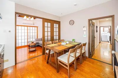 a kitchen and dining room with a table and chairs at Mori House \u5fd7\u83022-3F in Tokyo