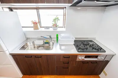 a kitchen with a sink and a stove at Mori House \u5fd7\u83022-3F in Tokyo