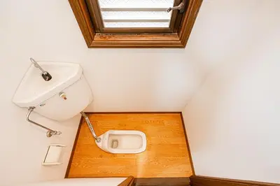 a bathroom with a toilet with a sink and a window at Mori House \u5fd7\u83022-3F in Tokyo