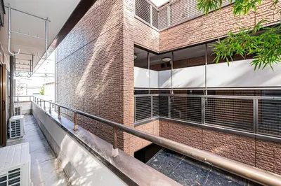 an external view of a brick building with a balcony at Mori House \u5fd7\u83022-3F in Tokyo