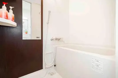 a bathroom with a bath tub and a sink at Akihabara Skytree Premium Apartment 401 in Tokyo