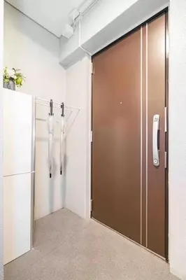 a large door in a room with a refrigerator at Akihabara Skytree Premium Apartment 401 in Tokyo