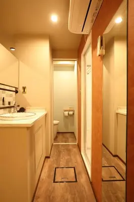 a bathroom with a sink and a toilet at the Moto Hotel Shinjuku in Tokyo