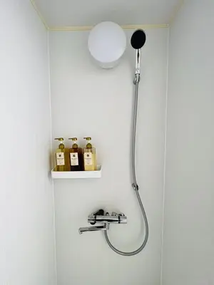 a shower with a shower head in a bathroom at HAMAMATSUCHO Mansion #Minato-Ku in Tokyo