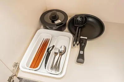 a white tray with silver utensils on a counter at Akihabara Skytree Premium Apartment 501 in Tokyo