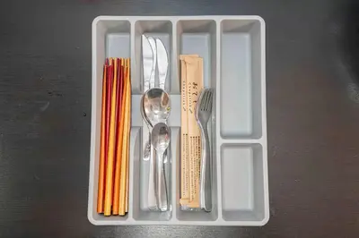 a plastic container filled with utensils and utensils at Akihabara Skytree Premium Apartment 501 in Tokyo