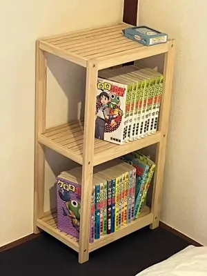 a book shelf filled with books in a bedroom at \u5fb9\u6c5f\u6238\u5ddd in Tokyo