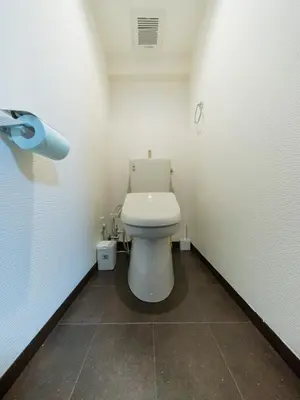 a bathroom with a white toilet in a stall at Tokiwa INN in Tokyo