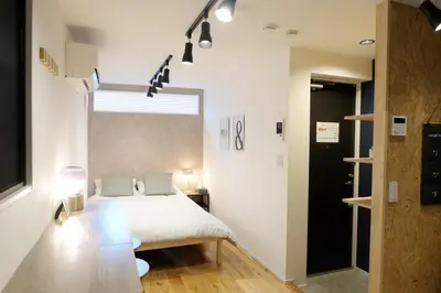 a bedroom with a bed and a large window at Horizon Bleu Asakusa Room 102 - Vacation STAY 01888v in Tokyo