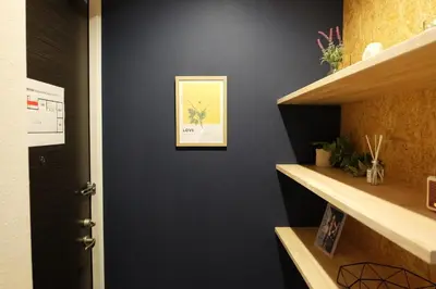 a hallway with a black wall with a picture on it at Horizon Bleu Asakusa Room 102 - Vacation STAY 01888v in Tokyo