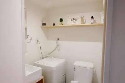 a small bathroom with a toilet and a sink at Horizon Bleu Asakusa Room 102 - Vacation STAY 01888v in Tokyo