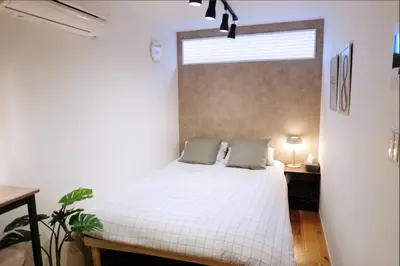 a bedroom with a white bed and a window at Horizon Bleu Asakusa Room 102 - Vacation STAY 01888v in Tokyo