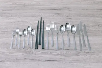 a group of silver forks and spoons on a table at 8min walk from Shibuya Sta Universal design in Tokyo