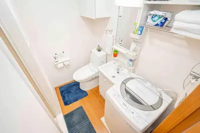 a bathroom with a white toilet and a sink at Akihabara Skytree Premium Apartment 102 in Tokyo