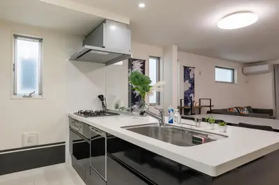 a kitchen with a sink and a counter top at Conveniently located 10 min walk from Shin-Okubo Station and 7 min walk from Higashi-Shinjuku Station -Okubo hosuse- in Tokyo