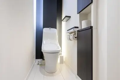 a bathroom with a white toilet in a room at Conveniently located 10 min walk from Shin-Okubo Station and 7 min walk from Higashi-Shinjuku Station -Okubo hosuse- in Tokyo
