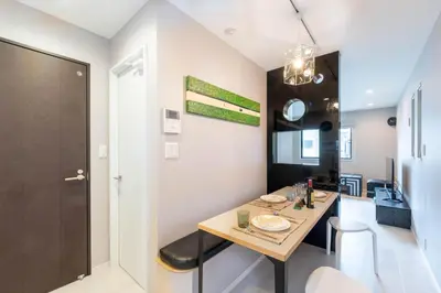 a kitchen and dining room with a table and chairs at \u5922\u306e\u5bbf\u5f69\u308a 127t in Tokyo