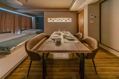 a dining room with a table and a bed at 365Ueno in Tokyo