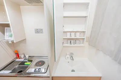 a small kitchen with a sink and a stove at Mori House \u795e\u697d\u5742 in Tokyo