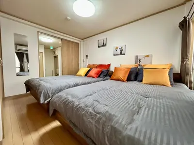 two beds sitting next to each other in a room at Tokyo Love House 2 in Tokyo