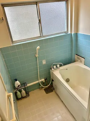 a bathroom with a bath tub and a window at Tokyo Love House 2 in Tokyo