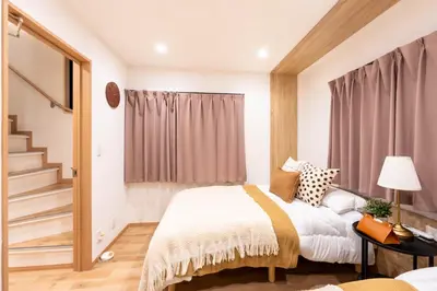 a bedroom with a bed and a staircase at \u78a7\u685c 126t in Tokyo