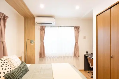a bedroom with a bed and a window at \u78a7\u685c 126t in Tokyo
