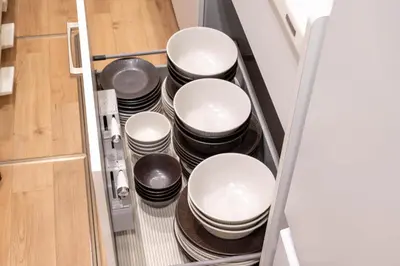 a stack of dishes in a drawer of a refrigerator at \u78a7\u685c 126t in Tokyo