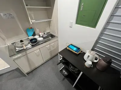 a small kitchen with a sink and a stove at Yamanote Line to Shinjuku or Shibuya in Tokyo