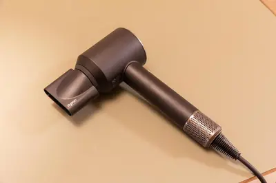 a black microphone on a yellow background at Homie Hiroo in Tokyo