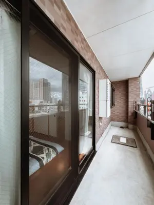 a room with large windows and a view of the city at Skytree STAR 11 Hotel in Tokyo