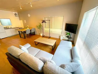 a living room with a couch and a table at Shibamata house self check in in Tokyo